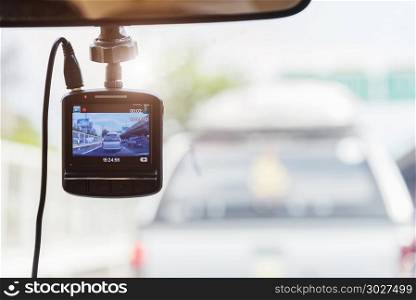 Recorder camera in front of car for safety on the road.