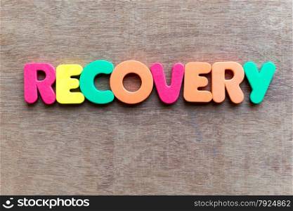 recovery colorful word in the wooden background