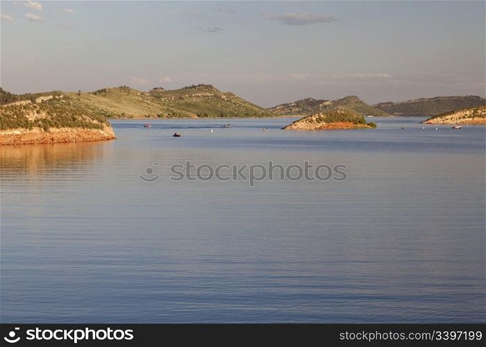 recreation boats on Horsetooth Reservoir near Fort Collins, Colorado, summer afternoon