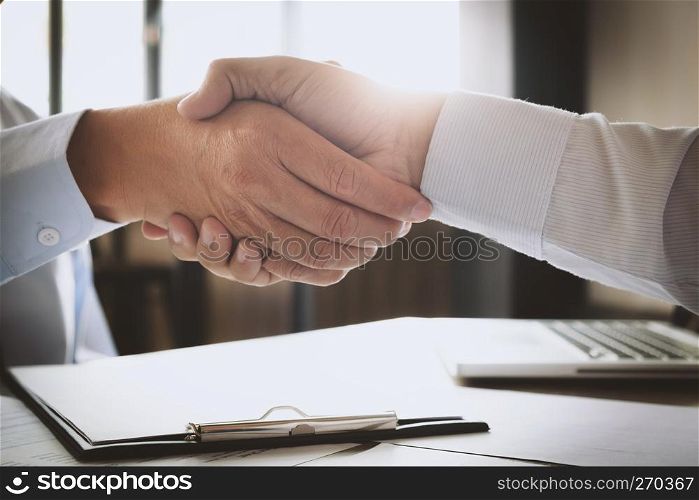 recruitment and interview concept , candidate with human resource manager handshaking.