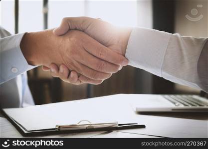 recruitment and interview concept , candidate with human resource manager handshaking.