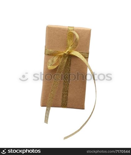 rectangle box wrapped in brown kraft paper and tied with a silk golden ribbon, gift isolated on a white background