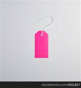 rectangle paper pink tags for things on a white rope, white background