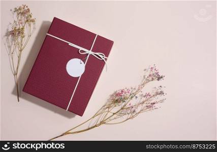 Rectangular gift cardboard box on beige background, top view