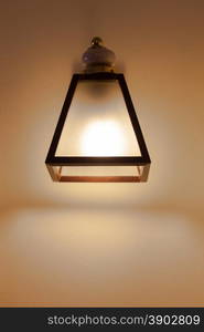 Rectangular lantern mounted on the Wall in the bedroom.