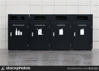 Recycle bins for rubbish, recycling and garden waste, over white wall background