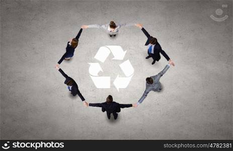 Recycle concept. Top view of business team making recycling figure
