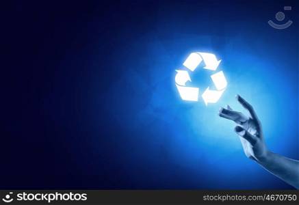Recycle icon. Close up of businessman touching media recycle icon