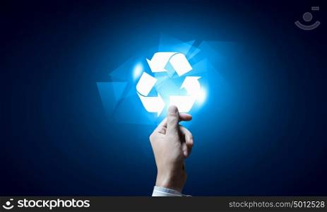 Recycle icon. Close up of businessman touching media recycle icon