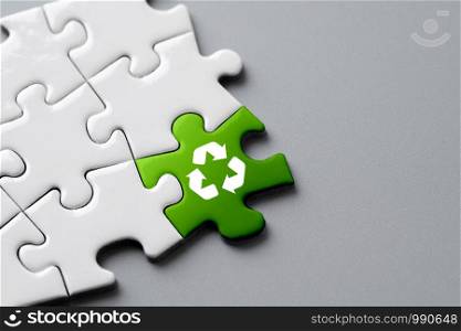 Recycle icon on jigsaw for eco & green concept