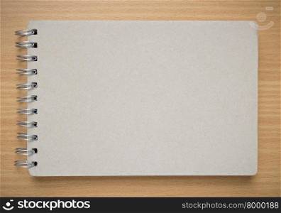 recycle notebook cover on wood background