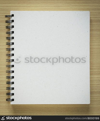 recycle notebook cover on wood background