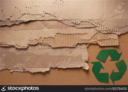 Recycle symbol at cardboard paper as background texture. Recycling concept and brown paper