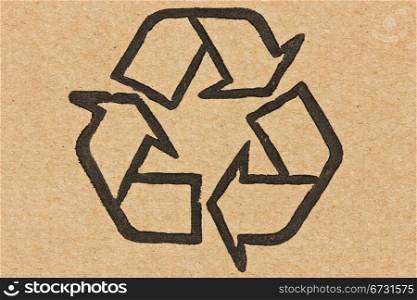 recycle symbol printed on a recycled cardboard