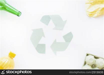 recycle symbol with trash corners