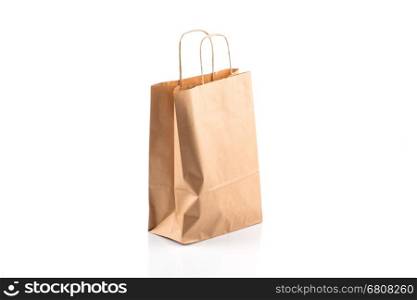 Recycled paper kraft shopping bag isolated on white background