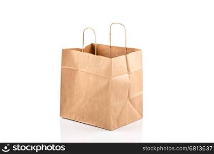 Recycled paper kraft shopping bag isolated on white background