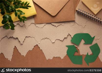 Recycling concept  and waste paper heap. Recycle symbol and product from recycled paper