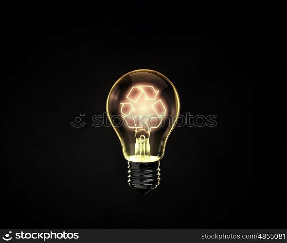 Recycling concept. Light bulb with recycle sign inside on dark background