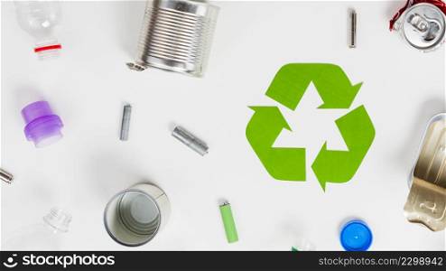 recycling icon around different litter