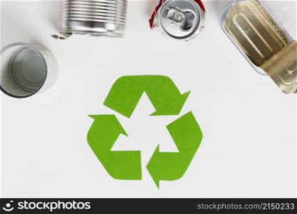 recycling symbol beside used metallic packaging