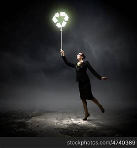 Recycling symbol. Image of businesswoman holding balloon with recycle symbol