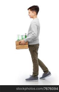 recycling, waste sorting and sustainability concept - smiling boy holding wooden box with glass bottles and jars walking over white background. smiling boy with wooden box sorting glass waste