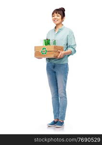 recycling, waste sorting and sustainability concept - smiling young asian woman holding wooden box with glass bottles and jars over white background. smiling young asian woman sorting glass waste