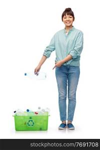 recycling, waste sorting and sustainability concept - smiling young asian woman holding box with plastic bottles over white background. smiling young asian woman sorting plastic waste