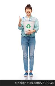 recycling, waste sorting and sustainability concept - smiling young asian woman holding bucket with plastic bottles over white background. smiling young woman sorting plastic waste