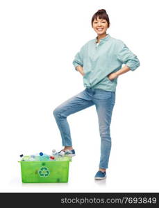 recycling, waste sorting and sustainability concept - smiling young asian woman holding box with plastic bottles over white background. smiling young asian woman sorting plastic waste