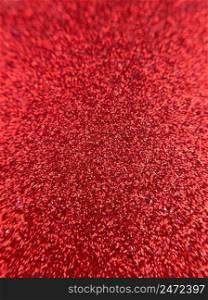 Red abstract glitter vertical texture background.. Red abstract sparkling glitter vertical texture backdrop.