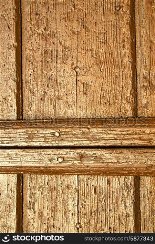 red abstract house door in italy lombardy column the milano old closed nail rusty