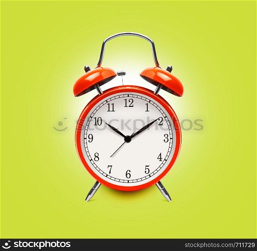 Red alarm clock isolated on yellow background