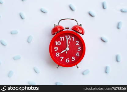 "Red alarm clock ring with "PrEP" ( Pre-Exposure Prophylaxis). used to prevent HIV on white background."