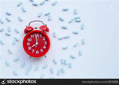 "Red alarm clock ring with "PrEP" ( Pre-Exposure Prophylaxis). used to prevent HIV. Top view"