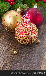 red and golden christmas balls . red and golden christmas balls on wooden table