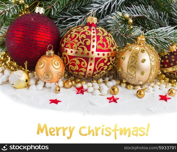 red and golden christmas decorations with evergreen tree on snow border on white background. golden christmas decorations