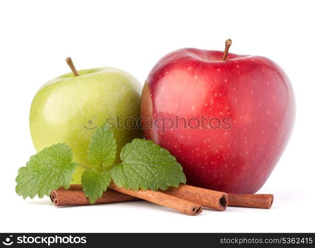 Red and green apples, cinnamon sticks and mint leaves still life isolated on white cutout