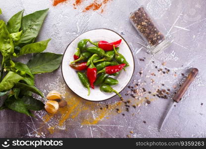 Red and green Chillies on white plate