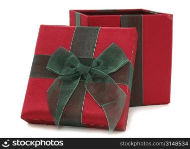 Red and green fabric gift box over white.
