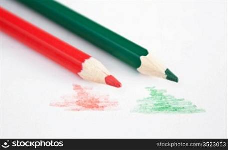 red and green pencil on the notepad