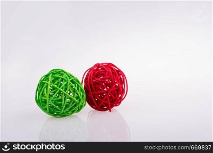 red and green wooden balls on a white background
