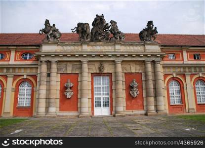 Red and stone, columns and entrance of historical building, Berlin