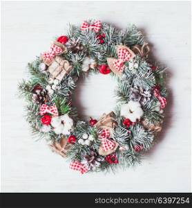 Red and white Christmas wreath. Red and white Christmas wreath with bows and cotton flowers