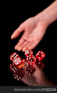 red and white craps or dices on reflective black background.. red and white craps or dices on reflective black background