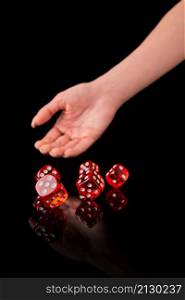 red and white craps or dices on reflective black background.. red and white craps or dices on reflective black background