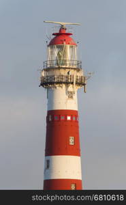 Red and white lighthouse on the dutch isle of Ameland, Holland