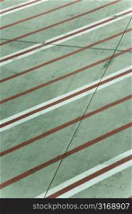 Red and white lines on runway concrete at Melbourne Airport, Australia