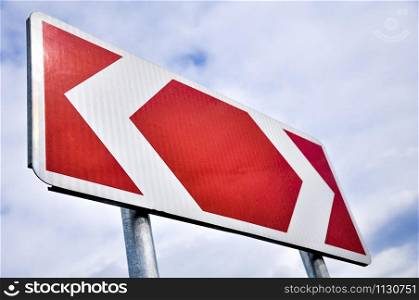 Red and white road sign indicating two directions.